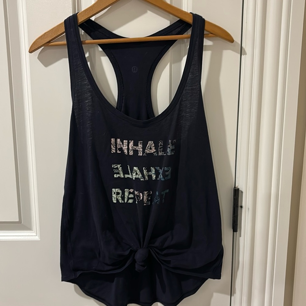 Lululemon racerback tank. Navy. Tags have been removed. Size 6.